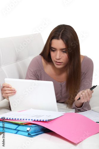 Photo: Female teenager revising Female teenager revising