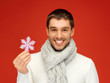 man in warm sweater and scarf with snowflake