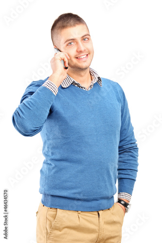 Photo: Smiling guy talking on a mobile phone Smiling guy talking on a mobile phone