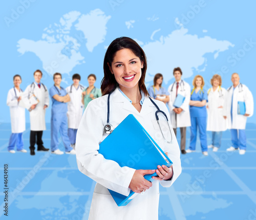 Photo: Doctor woman with a medical team. Health care. Doctor woman with a medical team. Health care.