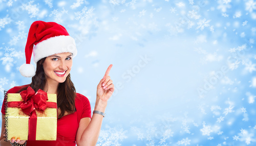 Photo: Christmas Santa woman with gift. Christmas Santa woman with gift.