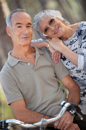 Photo: Senior couple riding bikes Senior couple riding bikes