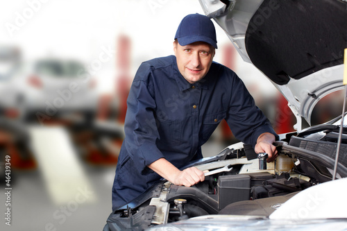 Photo: Professional auto mechanic. Professional auto mechanic.