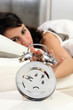 Woman turning off alarm