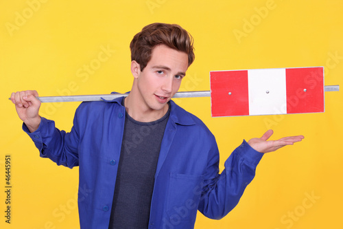 Photo: Building worker on yellow background Building worker on yellow background