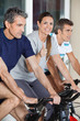 Woman Showing Thumbs Up Sign While Exercising With Friends On Sp
