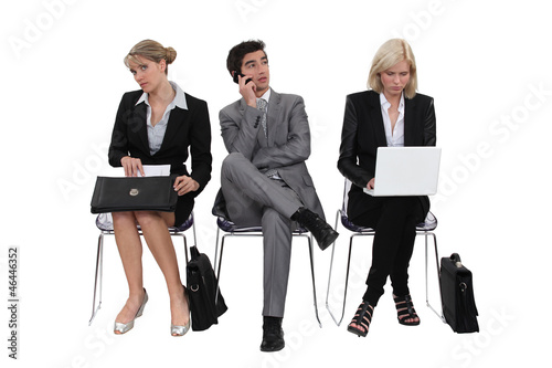 Photo: Executives sitting in a row Executives sitting in a row