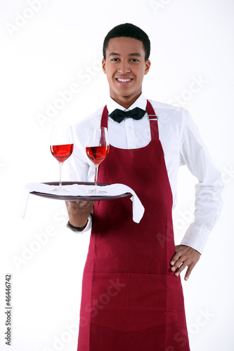 Photo: wine waiter serving two glasses of wine wine waiter serving two glasses of wine