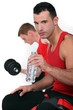 Two men working out at the gym
