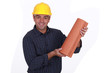 Roofer holding tiles