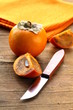 Persimmon fruit on a wooden table
