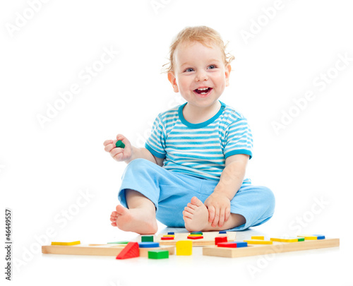 Photo: happy kid playing toys happy kid playing toys