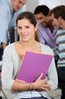 a girl posing in a classroom