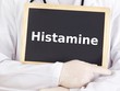 Doctor shows information on blackboard: histamine
