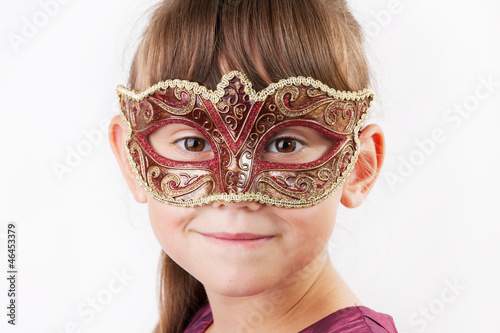 Photo: Charming girl in a carnival mask Charming girl in a carnival mask