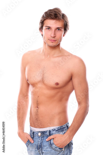 Photo: Handsome and sexy young man with naked torso isolated Handsome and sexy young man with naked torso isolated