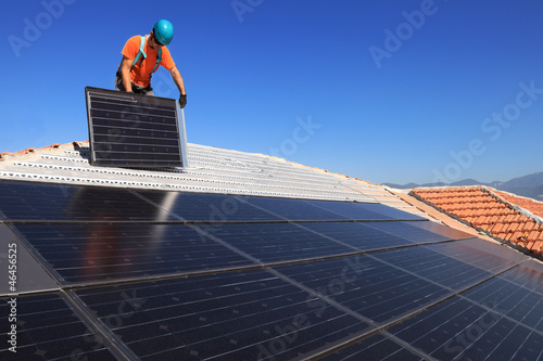 Photo: installing alternative energy photovoltaic solar panels installing alternative energy photovoltaic solar panels