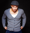 Photo: Portrait of handsome man posing on grey background Portrait of handsome man posing on grey background