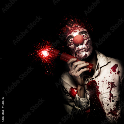 Photo: Evil Male Business Clown Holding Explosive Bomb Evil Male Business Clown Holding Explosive Bomb
