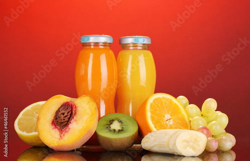 Photo: Delicious multifruit juice in a bottle and fruit next to it Delicious multifruit juice in a bottle and fruit next to it