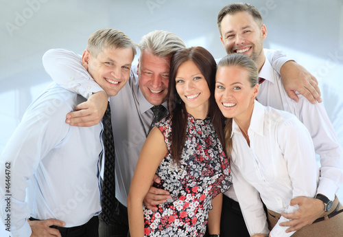 Photo: Closeup portrait of a successful business team laughing together Closeup portrait of a successful business team laughing together
