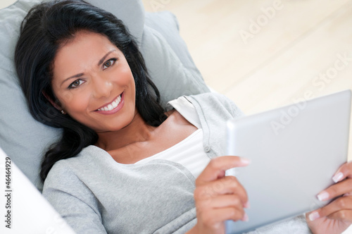 Photo: Girl smile with tablet Girl smile with tablet