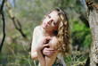 beautiful girl in green wood by summer
