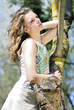 beautiful girl in green wood by summer