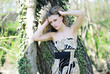 beautiful girl in green wood by summer