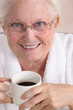 Portrait of an elderly woman drinking coffee