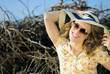 beautiful girl in shorts and hat on grapevine