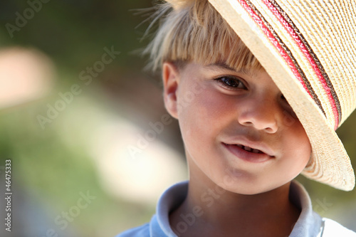 Photo: Little boy wearing straw hat Little boy wearing straw hat
