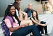 Photo: Young woman smiling with friends Young woman smiling with friends