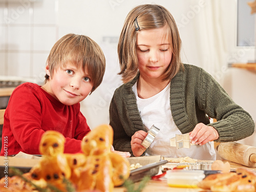 Photo: kids preparing a yeast dough kids preparing a yeast dough