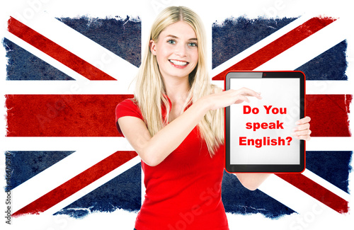 Photo: young woman holding tablet pc. english learning concept young woman holding tablet pc. english learning concept