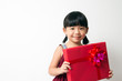 Asian child with red gift box