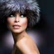 Fashion. Beautiful Girl in Fur Hat. Winter Woman
