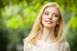 Beautiful young blond woman outdoors