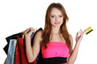 Photo: Woman with shopping bags holding credit card Woman with shopping bags holding credit card