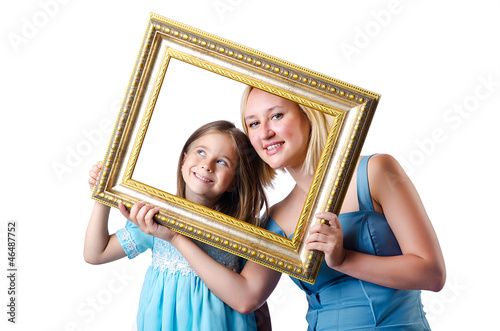 Photo: Happy mom and daughter on white Happy mom and daughter on white