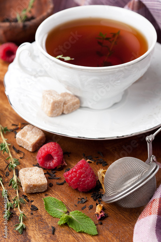 Photo: Tea with raspberries, fresh mint, thyme and brown sugar Tea with raspberries, fresh mint, thyme and brown sugar