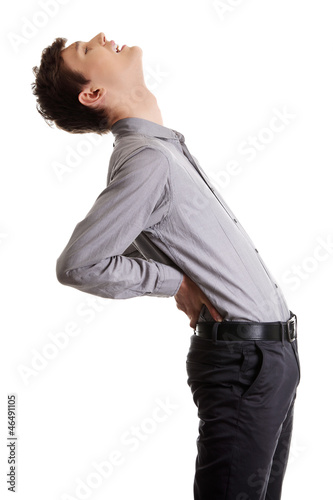 Photo: Young male with back pain Young male with back pain