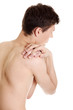 Young man with hands on his back