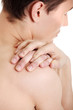Young man with hands on his back