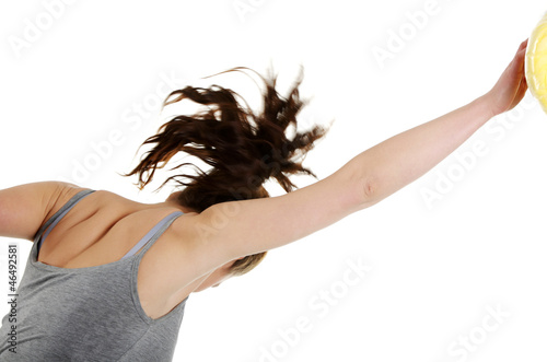 Photo: Young woman with fists up punching something Young woman with fists up punching something