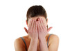 Frighten woman hides her face in hands