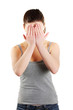 Frighten woman hides her face in hands