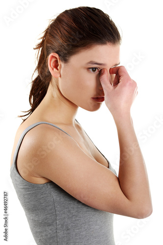 Photo: Young woman with sinus pressure pain Young woman with sinus pressure pain