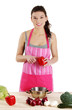 Young woman cooking healthy food in pot