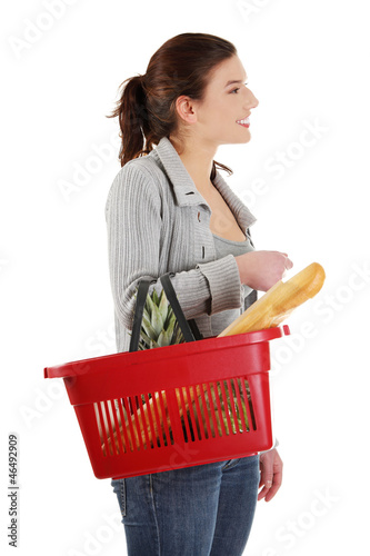 Photo: Happy woman with shopping basket Happy woman with shopping basket